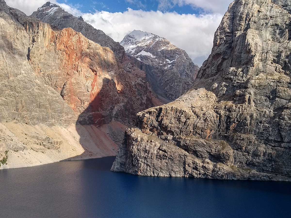 Bolshoi Allo Lake surrounded by steep rock cliffs