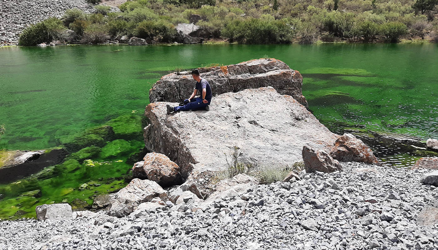 Emerald green crystal clear Malo Allo Lake