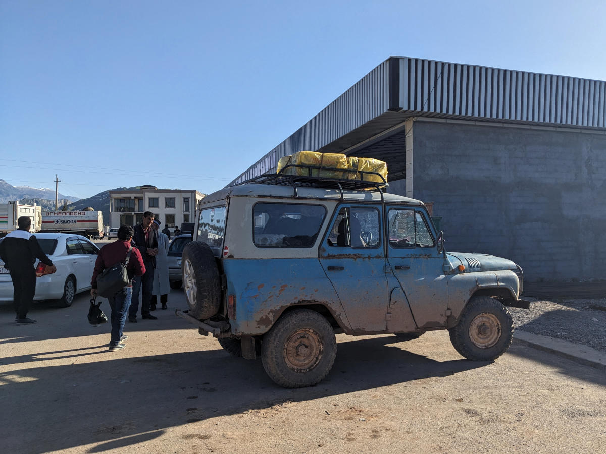 Old Russian UAZ jeep parked at the Baljuvon taxi stand