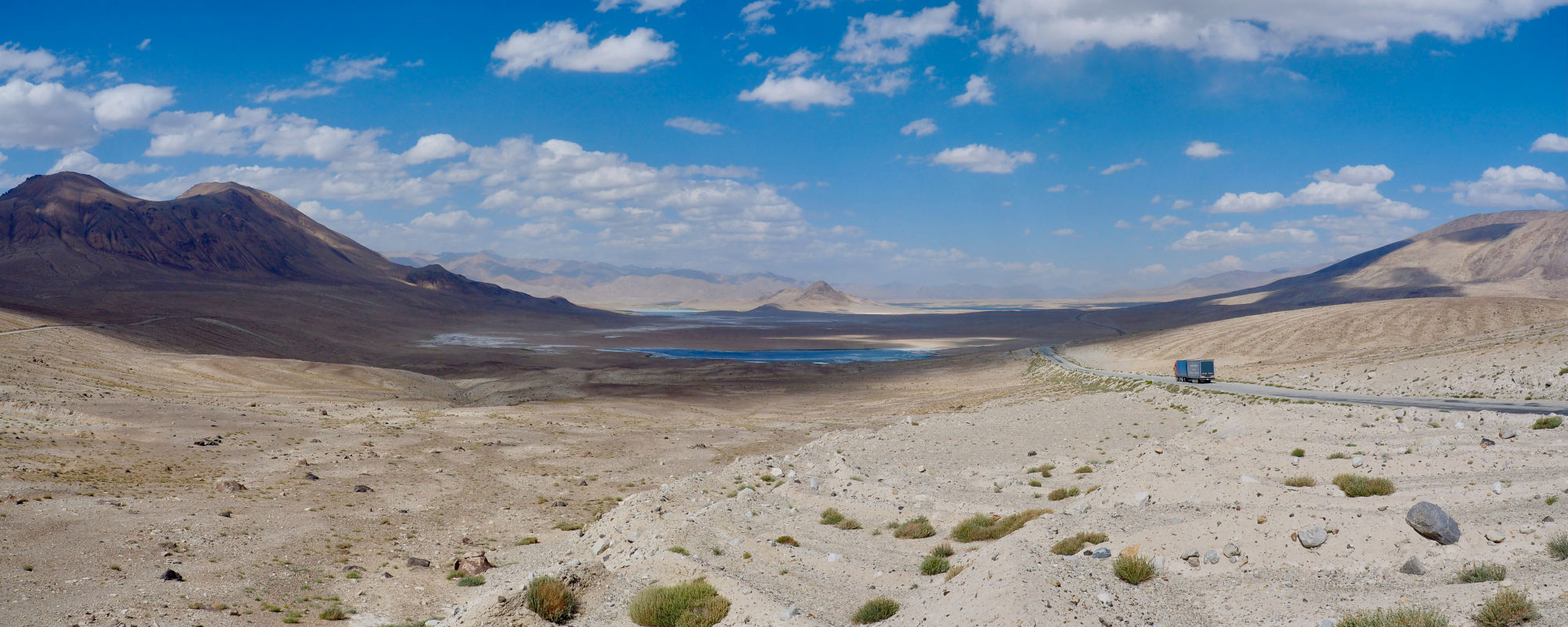 Truck driving on the Pamir Highway towards the lakes of Tuzkul and Sassykul