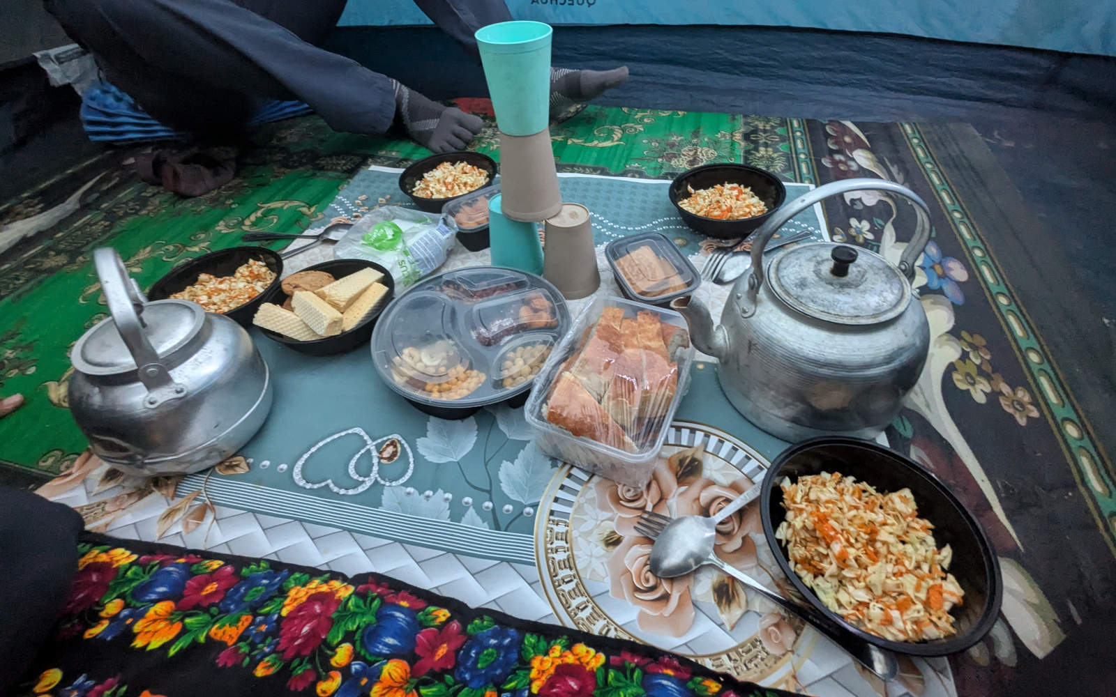 Breakfast meal during Trek Tajikistan treks with breads, salads, cookies, nuts, dried fruits and tea.