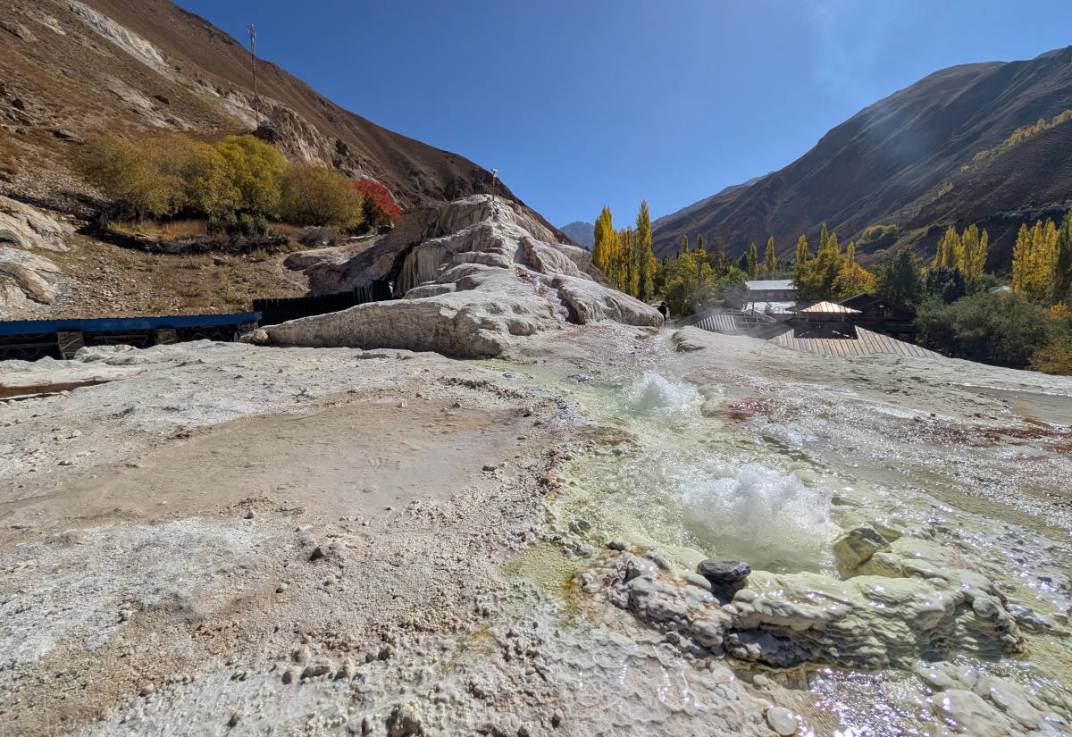 Hydrothermal waters coming out of the ground at Garm Chashma (Darmadar) with travertines