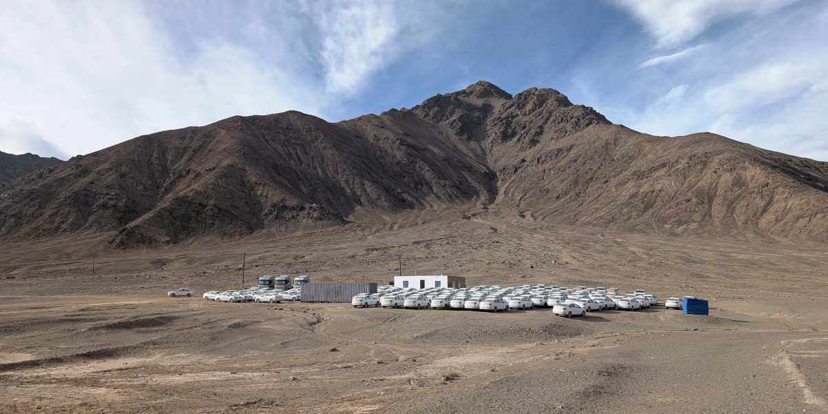 Gathering point near Murghab of many white electrical cars from China
