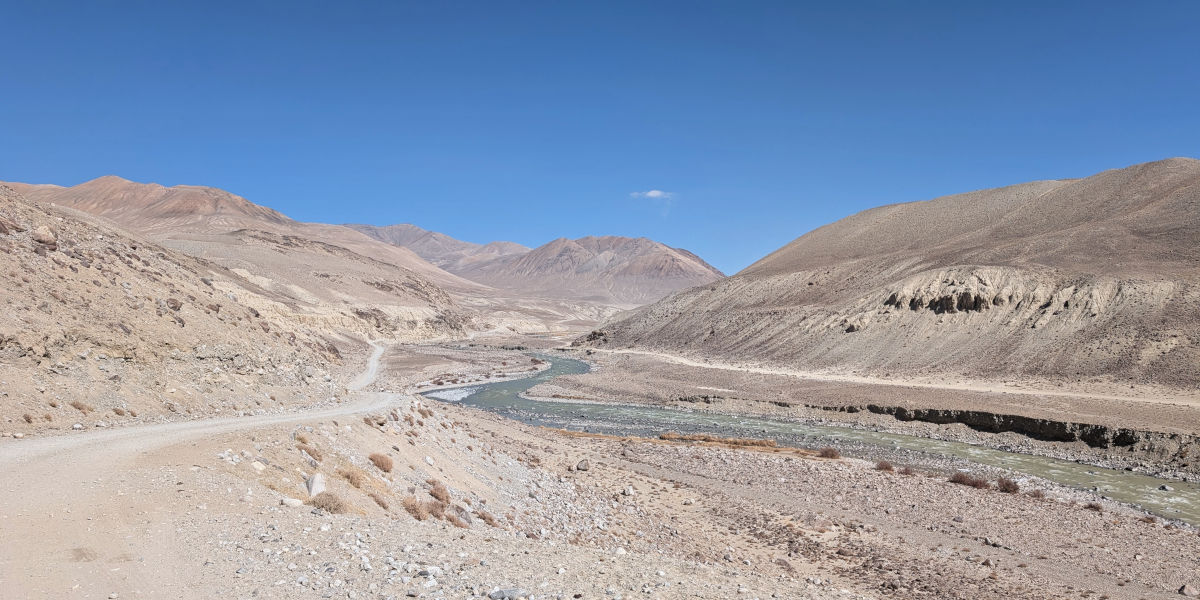 Panj River cutting through barren landscapes in the eastern part of the Wakhan Valley in Tajikistan